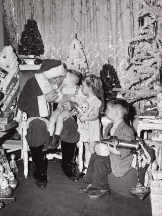 Babe Ruth Dressed as Santa and Children photograph, 1947 December 10