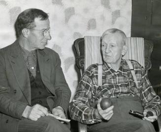 Cy Young talks to Cy Young (Reporter) photograph, 1954