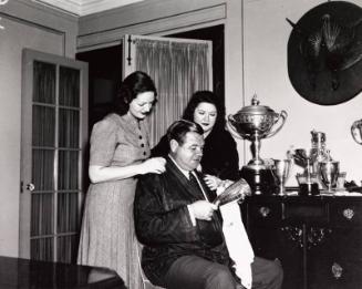 Babe, Claire, and Julia Ruth Polishing Trophies photograph, 1937 October 24