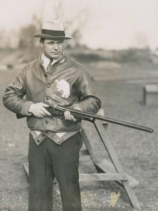 Jimmie Foxx Standing with Gun photograph, 1933 January 28
