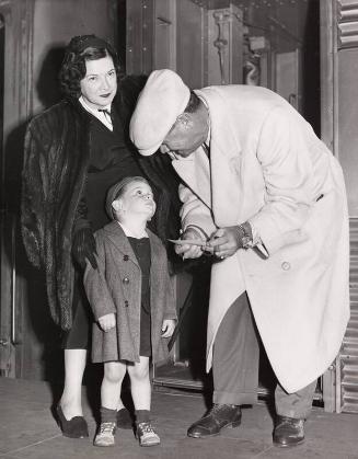 Babe Ruth Signing Autograph for Young Boy photograph, 1948 April 28