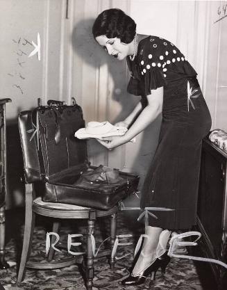 Claire Ruth Packing Suitcase photograph, undated
