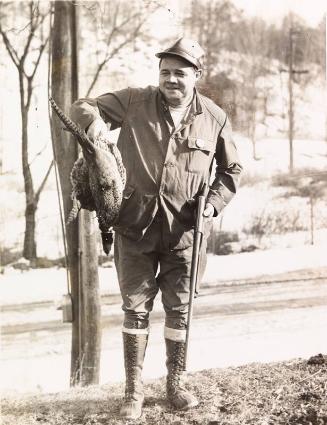 Babe Ruth Holding a Dead Bird photograph, 1935 February 25