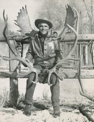 Bing Miller Posed with Antlers photograph, possibly 1936