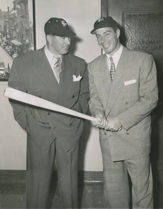 Lefty O'Doul and Joe DiMaggio Posing with Bat photograph, 1950 February 06