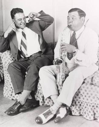 Babe Ruth Playing Saxophone next to Lou Gehrig photograph, undated