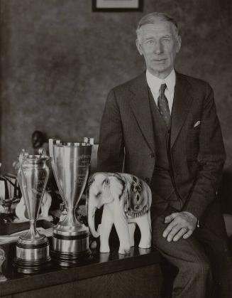 Connie Mack with Trophies photograph, 1932 December 22