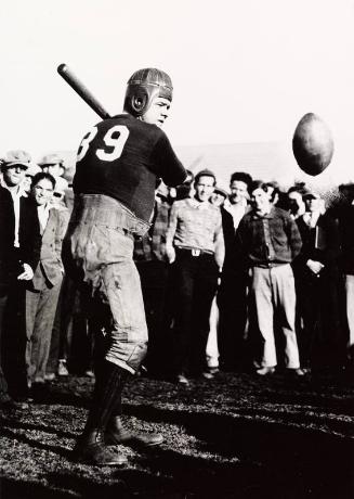 Babe Ruth Hitting Football photograph, undated