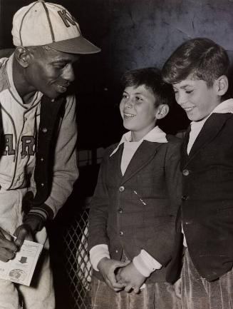Satchel Paige Signing Autograph photograph, between 1935 and 1947