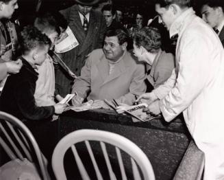 Babe Ruth Signing Autographs for Kids photograph, 1944 April 22