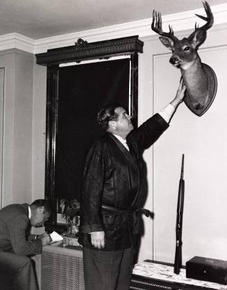 Babe Ruth Posing with Mounted Deer Head photograph, 1937 October 24