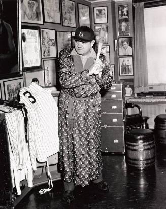 Babe Ruth Posing with Bat at His Apartment photograph, 1942 January 31