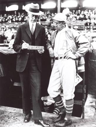 Eddie Collins and Connie Mack Looking at a Newspaper, 1929 or 1930