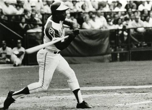 Hank Aaron hitting 701st and 702nd home runs photographs, 1973 July 31 and August 16